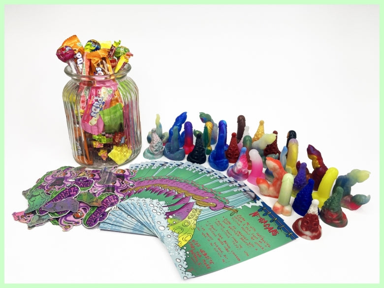 A jar of sweets, a pile of assorted stickers, a selection of tiny silicone squishies and a fanned out pile of colourful toy aftercare cards. On a white background.