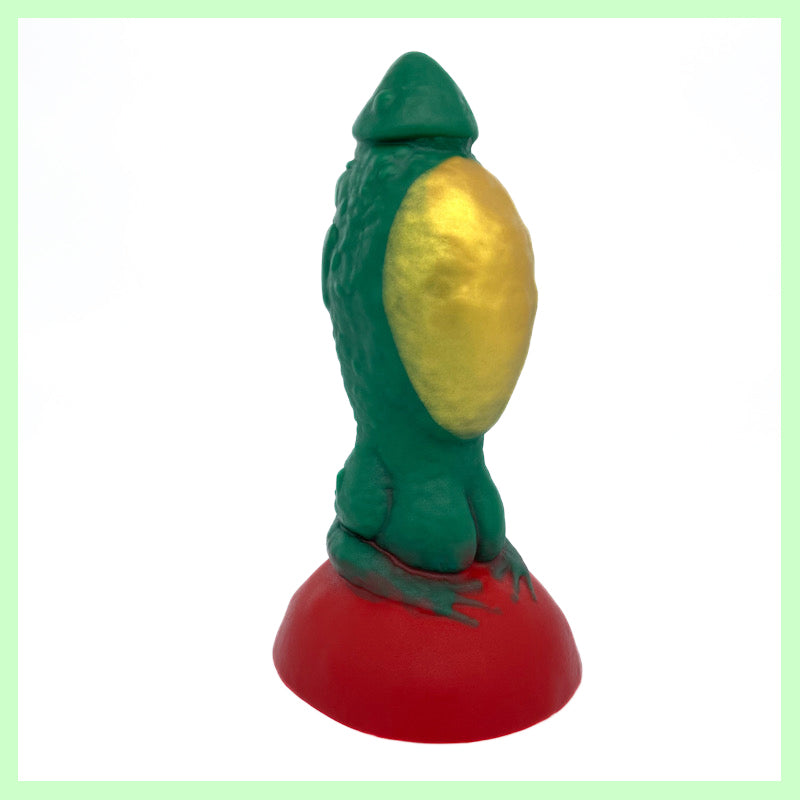 Toady Stool dildo front view. Toad-themed dildo with a green body, gold belly and red toad stool perch