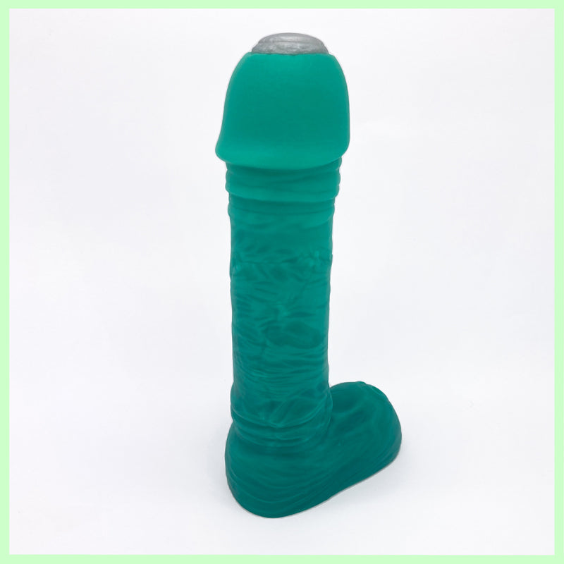 Fronky green Frankenstein dildo rear view in green with silver tip on white background
