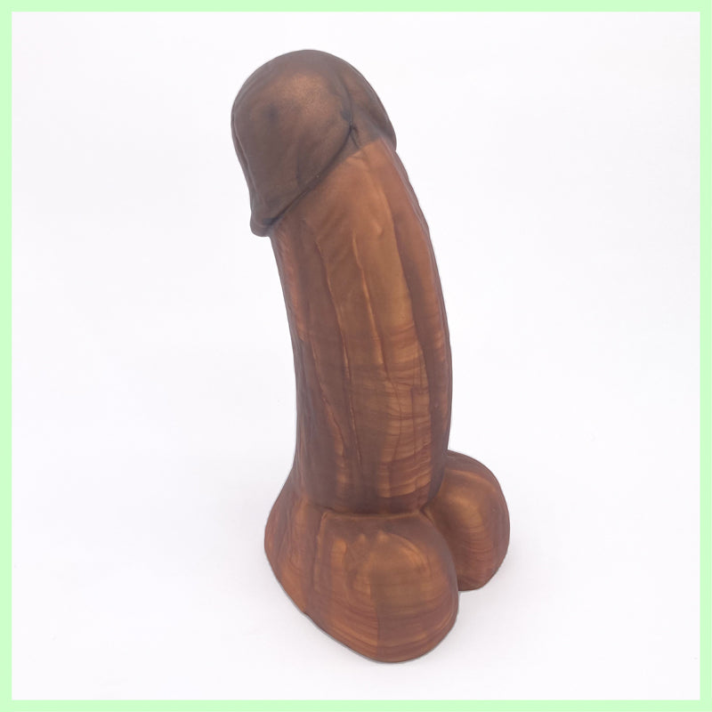 Woodsman dildo in brown and bronze with wood grain detail