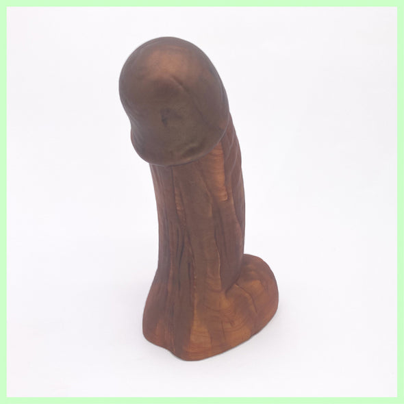 Woodsman dildo rear view in brown and bronze with wood grain detail